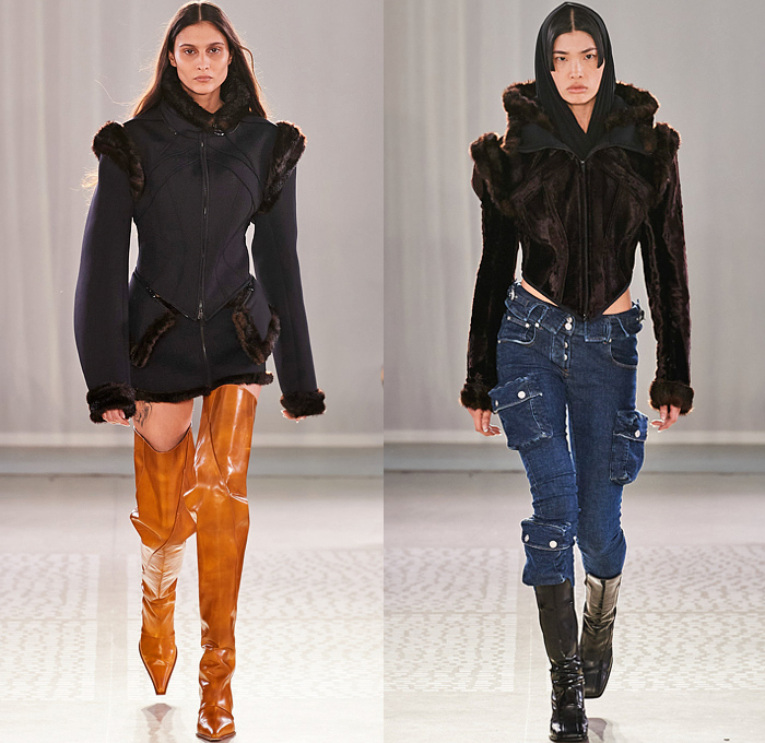 Trussardi 2022-2023 Fall Autumn Winter Womens Runway Looks - Milano Moda Donna Collezione Milan Fashion Week Italy - Strapless Open Shoulders Crop Top Midriff Quilted Puffer Jacket Hoodie Oversized Outerwear Coat Fur Shearling Velvet Zipper Corset Shapewear Crinoline Poodle Skirt High Slit Knit Denim Jeans Miniskirt Wide Leg Baggy Loose Pleats Utility Pockets Cargo Pants Thigh High Boots Handbag Purse