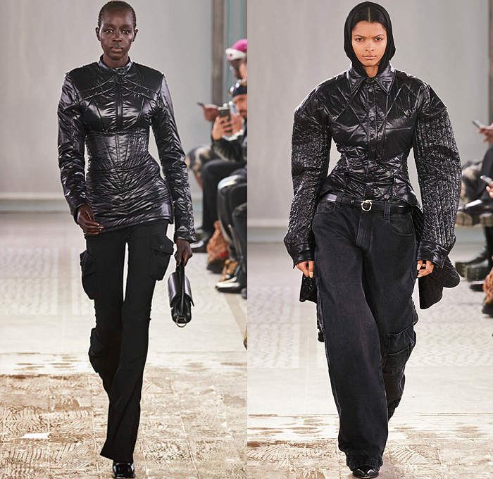 Trussardi 2022-2023 Fall Autumn Winter Womens Runway Looks - Milano Moda Donna Collezione Milan Fashion Week Italy - Strapless Open Shoulders Crop Top Midriff Quilted Puffer Jacket Hoodie Oversized Outerwear Coat Fur Shearling Velvet Zipper Corset Shapewear Crinoline Poodle Skirt High Slit Knit Denim Jeans Miniskirt Wide Leg Baggy Loose Pleats Utility Pockets Cargo Pants Thigh High Boots Handbag Purse