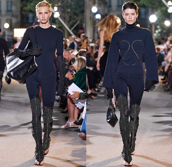 Alaïa Winter Spring 2022 Womens Runway Looks Collection - Draped Hood Denim Jeans Pantsuit Blazer Jacket Mesh Fishnet Coat Onesie Unitard Coveralls Bodysuit Jumpsuit Fringes Wide Sleeves Turtleneck Halterneck Dress Velvet Crop Top Midriff Body Contour Bodycon Fur Ribbed Knit Plastic Rainwear Parka Belt Corset Eyelets Metal Balls Bearings Bedazzled Beads Studs Poodle Skirt Shirtdress Miniskirt Sheer Tulle Gown Fringes Leggings Tights Gloves Handbag Tote Clogs