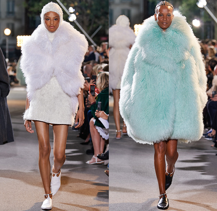 Alaïa Winter Spring 2022 Womens Runway Looks Collection - Draped Hood Denim Jeans Pantsuit Blazer Jacket Mesh Fishnet Coat Onesie Unitard Coveralls Bodysuit Jumpsuit Fringes Wide Sleeves Turtleneck Halterneck Dress Velvet Crop Top Midriff Body Contour Bodycon Fur Ribbed Knit Plastic Rainwear Parka Belt Corset Eyelets Metal Balls Bearings Bedazzled Beads Studs Poodle Skirt Shirtdress Miniskirt Sheer Tulle Gown Fringes Leggings Tights Gloves Handbag Tote Clogs