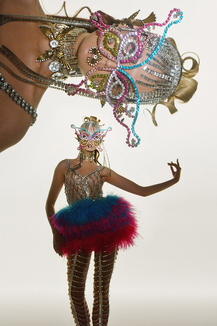 Area NYC 2022 Spring Couture Womens Lookbook Presentation - Haute Couture Avant Garde High Fashion - Brazilian Carnival Showgirls Bedazzled Beads Crystals Sequins Studs Metal Gold Wings Sculpture Headpiece Denim Jeans Cutoffs Shorts Crop Top Midriff Mask Feathers Corset Slashed Asymmetrical Bikini Top Houndstooth Chain Plaid Check Heart Miniskirt Pantsuit Blazer Cutout Wide Leg Crinoline Tuxedo Jacket Tights Stockings Swirls Strapless Butterflies Puff Ball Opera Gloves Gown Clogs