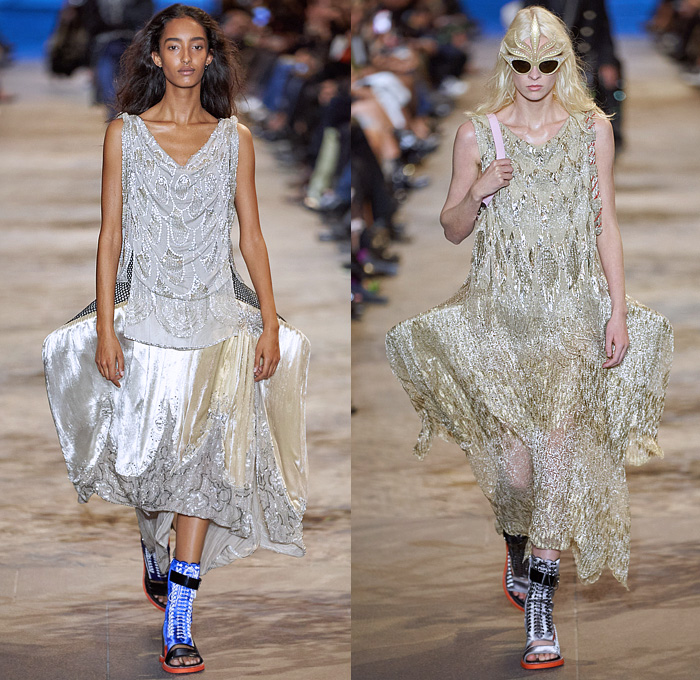 Louis Vuitton 2022 Spring Summer Womens Runway Looks Collection - Mode à Paris Fashion Week France - Mask Vampire Headwear Bedazzled Gems Crystals Sequins Studs Beads Mesh Lace Embroidery Crop Top Midriff Boxy Blazer Jacket Denim Jeans Noodle Strap Ruffles Sheer Tulle Organza Polka Dots Crinoline Skirt Victorian Quilted Puffer Coat Cape Cloak Vest Stripes Jodhpurs Equestrian Pants Cutout Puritan Collar Draped Dress Gown Culottes Open Toe Sandals Handbag Sunglasses