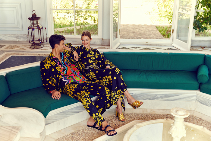 Rianna + Nina 2022 Spring Summer Womens Mens Lookbook Presentation - Mode à Paris Fashion Week France - Geometria 1960s Sixties Hollywood Villa Lace Embroidery Broderie Anglaise Kantha Caftan Kaftan Maxi Dress Pantsuit Blazer Jacket Geometric Tribal Shapes Ornaments Decorative Art Robe Coat Kimono Flare Wide Leg Palazzo Pants Blouse Sleeveless Tabard Vest Quilted Onesie Coveralls Jumpsuit Shorts Mesh Loungewear Bow Tied Flowers Floral Lion Swimwear Swimsuit Bikini Handbag Bag Tote