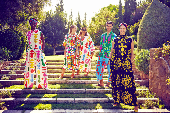 Rianna + Nina 2022 Spring Summer Womens Mens Lookbook Presentation - Mode à Paris Fashion Week France - Geometria 1960s Sixties Hollywood Villa Lace Embroidery Broderie Anglaise Kantha Caftan Kaftan Maxi Dress Pantsuit Blazer Jacket Geometric Tribal Shapes Ornaments Decorative Art Robe Coat Kimono Flare Wide Leg Palazzo Pants Blouse Sleeveless Tabard Vest Quilted Onesie Coveralls Jumpsuit Shorts Mesh Loungewear Bow Tied Flowers Floral Lion Swimwear Swimsuit Bikini Handbag Bag Tote