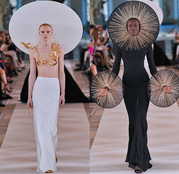 Schiaparelli 2022 Spring Couture Womens Runway Catwalk Looks - Haute Couture Avant Garde High Fashion - Planet Wide Brim Hat Gold Plated Swirls Giant Rings Plates Discs Sequins Gemstones Jewels Rhinestones Crystals Cabochons Sheer Tulle Veil Boxy Shoulders Cone Bra Strapless Tiara Sunburst Breastplate Feathers Wires Headdress Corset Pellegrina Blazer Jacket Cross Velvet Cinch Dress Gown Shorts Stockings Tights Bicycle Shorts Ruffles Branches Hands Trees Birds Chariot Horses Handbag