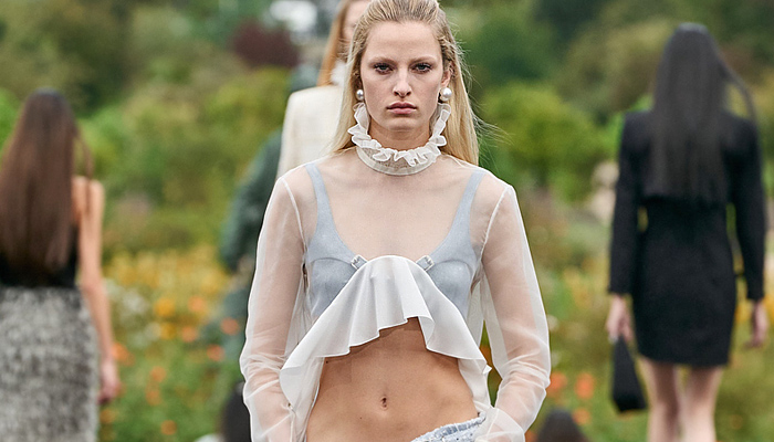 Givenchy 2023 Spring Summer Womens Runway Collection - Mode à Paris Fashion Week France - Bralette Straps Belts Crop Top Midriff Denim Jeans Cargo Shorts Utility Pockets Sheer Organza Chiffon Ruffles Bell Hem Tweed Hoodie Sweatshirt Coat Parka Split Half Loungewear Rope Fishnet Mesh Fringes Baggy One Shoulder Noodle Strap Party Dress Pearls Bedazzled Wrap Draped Cinch Pencil Skirt Gown Strapless Accordion Pleats Opera Gloves Handbag Gladiators