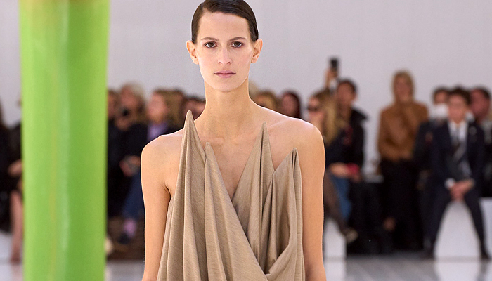 Loewe 2023 Spring Summer Womens Runway - Mode à Paris Fashion Week France - Anthurium Phallic Symbol Breast Cover Flowers Floral Sculpture Hotpants Noodle Strap Curtain Rods Draped Sheer Tulle Pompoms Stripes Cocktail Babydoll Dress Shirtdress Cropped Knit Blouse Oversized Elongated Sweaterdress Hanging Sleeve A-line Field Trench Jacket Pixels Baggy Sweatshirt Hoodie Crinoline Petticoat Strapless Foam Board Handbag Sandals Plastic Balloon Tubes Slippers