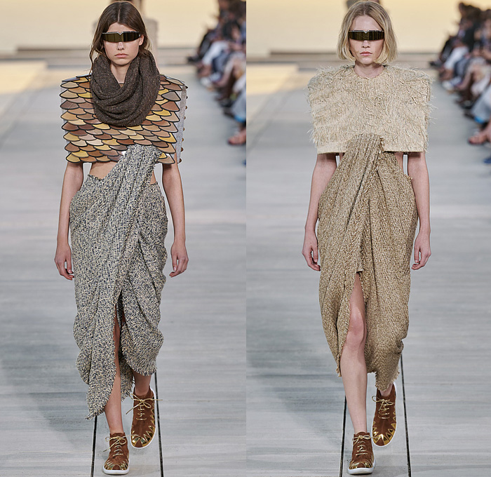 Louis Vuitton 2023 Resort Cruise Pre-Spring Womens Runway Catwalk Looks - Greek Goddess Mythology Amazon Warrior Medieval Armor Scales Cross Vest Deconstructed Belt Gold Feathers Embossed Brocade Jacquard Tiles Knit Fringes Draped Crop Top Midriff Capsleeve Boxy Frankenstein Shoulders Marbled Sequins Hood Wide Lapel Skirt Metal Linen Tweed Tapered Denim Jeans Zipper Anorak Sheer Tulle Leather Chain Pockets Biker Jacket Coat Dress Gown Handbag Studs Boots Gloves Sneakers Aviator Cap