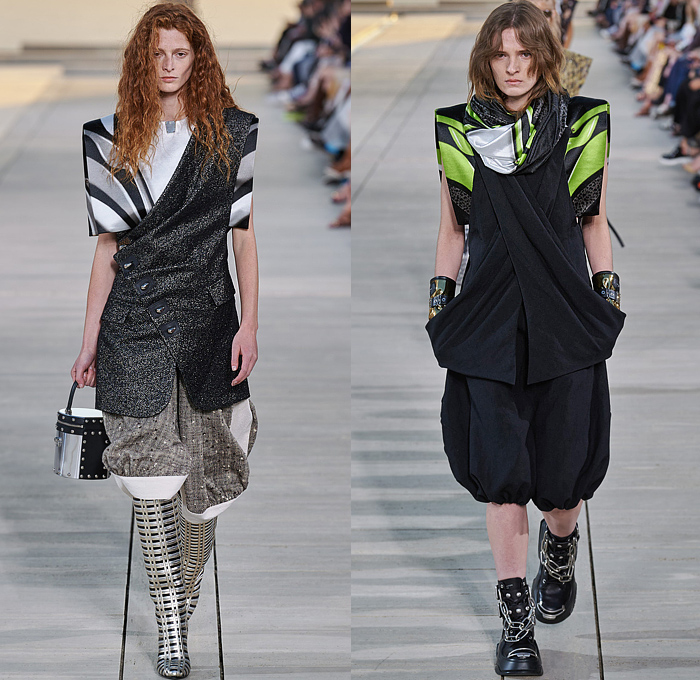 Louis Vuitton 2023 Resort Cruise Pre-Spring Womens Runway Catwalk Looks - Greek Goddess Mythology Amazon Warrior Medieval Armor Scales Cross Vest Deconstructed Belt Gold Feathers Embossed Brocade Jacquard Tiles Knit Fringes Draped Crop Top Midriff Capsleeve Boxy Frankenstein Shoulders Marbled Sequins Hood Wide Lapel Skirt Metal Linen Tweed Tapered Denim Jeans Zipper Anorak Sheer Tulle Leather Chain Pockets Biker Jacket Coat Dress Gown Handbag Studs Boots Gloves Sneakers Aviator Cap