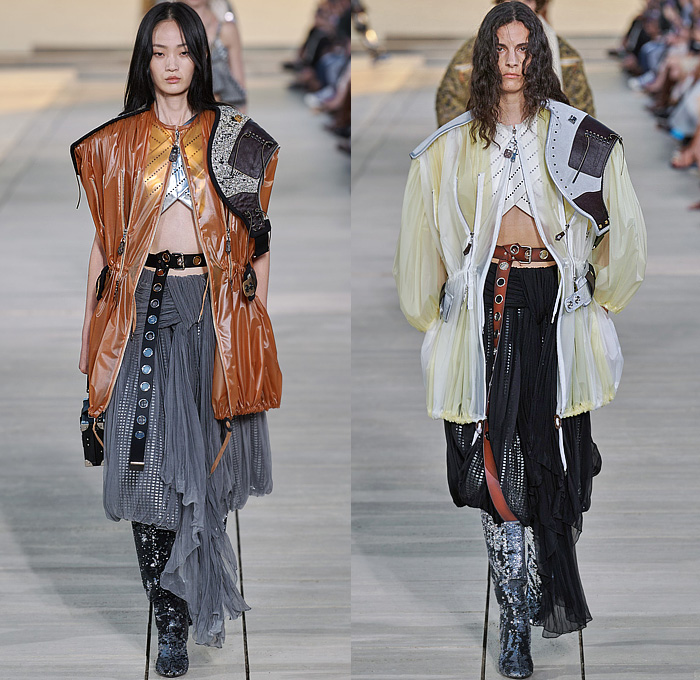 Louis Vuitton 2023 Resort Cruise Pre-Spring Womens Runway Catwalk Looks - Greek Goddess Mythology Amazon Warrior Medieval Armor Scales Cross Vest Deconstructed Belt Gold Feathers Embossed Brocade Jacquard Tiles Knit Fringes Draped Crop Top Midriff Capsleeve Boxy Frankenstein Shoulders Marbled Sequins Hood Wide Lapel Skirt Metal Linen Tweed Tapered Denim Jeans Zipper Anorak Sheer Tulle Leather Chain Pockets Biker Jacket Coat Dress Gown Handbag Studs Boots Gloves Sneakers Aviator Cap