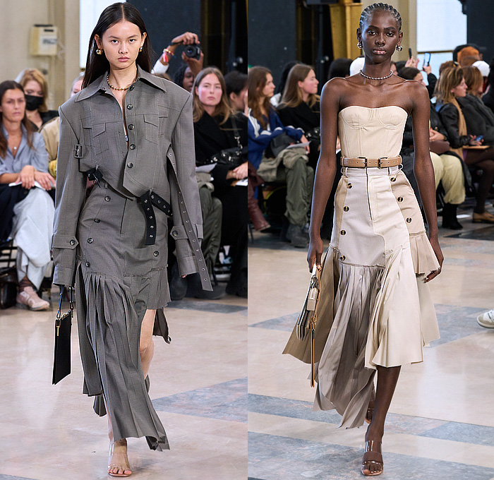 Rokh 2023 Spring Summer Womens Runway Collection - Mode à Paris Fashion Week France - Irrational View Accordion Pleats Trench Coat Lace Embroidery Crop Top Midriff Asymmetrical Patchwork Deconstructed Raw Hem Unfinished Frayed Tiered Bedazzled Metal Studs Blazer Jacket Straps Belts Grommets Holes Hooks Fringes Pencil Skirt Paper Bag Waist Bandeau Bralette Zipper Patchwork Stripes Strapless Pockets Jagged Ripped Torn Dress One Shoulder Cutout Wide Leg Flare Pantsuit Handbag Sandals
