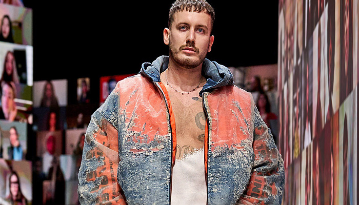 Diesel 2024-2025 Fall Autumn Winter Mens Runway Looks - Milan Fashion Week MFW Italy - Glenn Martens - Jersey Devoré Burnt Sweat Stains Fabric Treatments Grunge Destroyed Destructed Denim Jeans Coated Painted Layers Faux Fur Disintegrate Damaged Rustic Sheer Ribbed Knit Sweatshirt Pockets Leopard Flowers Floral Coat Parka Wide Leg Baggy Puffer Padded Quilted Biker Motorcycle Pants Metallic Slouchy Vest Suit Blazer Jacket Embroidery Feathers Baseball Cap Boots