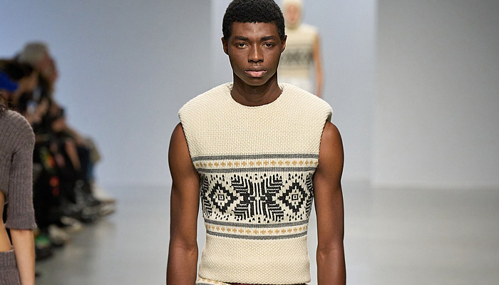 Duran Lantink 2024-2025 Fall Autumn Winter Mens Runway Looks - Paris Fashion Week Femme PFW - Duran-ski - Hood Balaclava Sleeveless Vest Gilet Quilted Puffer Crop Top Midriff Leather Bulky Ribbed Knit Padded Chevron Turtleneck Sweater Jumper Banded Briefs Decorative Art Ornamental Laces Patchwork Corduroy Slit Slash Cutout Onesie Jacketall Anorak Coat Plush Fur Wide Lapel Velvet Trousers Slouchy Wide Leg Leggings Thigh High Gloves