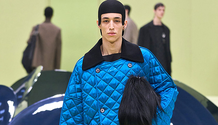 Jil Sander 2024-2025 Fall Autumn Winter Mens Runway Looks - Milan Fashion Week MFW Italy - Helmet Knit Crochet Embroidery Leaves Foliage Plants Tank Top Geometric Crystals Fringes Leather Anorak Hood Oversized Outerwear Coat Suit Blazer Quilted Waffle Shaggy Fur Shearling Shawl Cape Handbag File Folder Mary Janes Boots