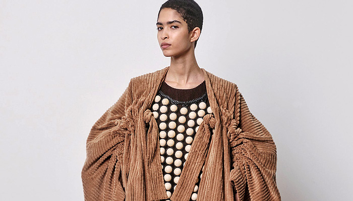 Niccolò Pasqualetti 2024-2025 Fall Autumn Winter Womens Collection - Paris Fashion Week PFW - Fur Plush Wool Coat Robe Bedazzled Giant Pearls Beads Spheres Cape Blazer Jacket Frayed Raw Hem Geometric Wrap Sash Crocodile Patchwork Crinoline Lantern Poodle Skirt Metal Foil Cuffs Cutout Check Crosshatch Corduroy Zipper Peel Away Miniskirt Deconstructed Knit Sweater Jumper Draped Puff Sleeves Bell Bottom Flare Velvet Stripes Dress Denim Jeans Leather Boots Handbag Petals