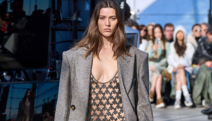 Stella McCartney 2024-2025 Fall Autumn Winter Womens Runway Collection - Paris Fashion Week PFW - Mother Earth - Knit Turtleneck Fur Sweater Patches Patchwork Loops Herringbone Sequins Studs Blazer Trench Coat Dress Tassels Fringes Draped Pleats Shorts Onesie Jumpsuit Padded Shoulders High Slit Cutout Crystals Mesh Strapless Gown Train Halterneck Crop Top Midriff Shirtdress Swimsuit Leather Crocodile Skirt Denim Jeans Snap Buttons Tearaway Wide Leg Handbag Chain Boots