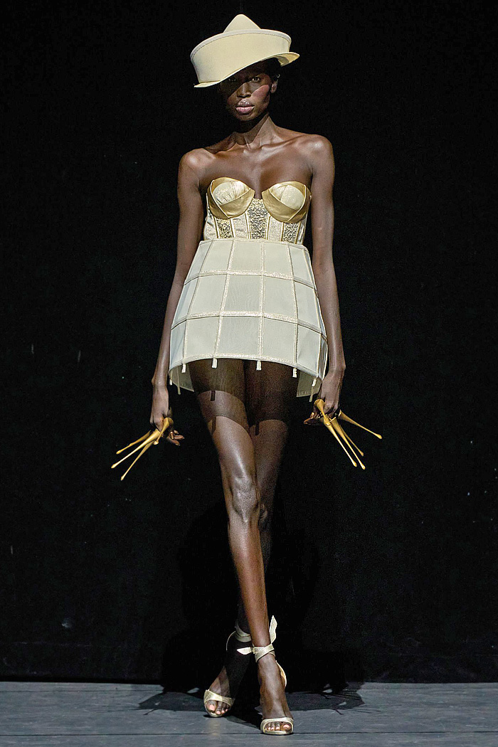 Ronald van der Kemp Fall 2025 Couture: birds, fish, banana leaves, gold corset bustiers, brocade gowns, patchwork knit scraps