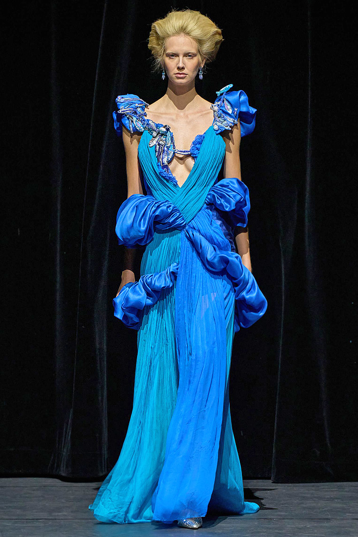 Ronald van der Kemp Fall 2025 Couture: birds, fish, banana leaves, gold corset bustiers, brocade gowns, patchwork knit scraps