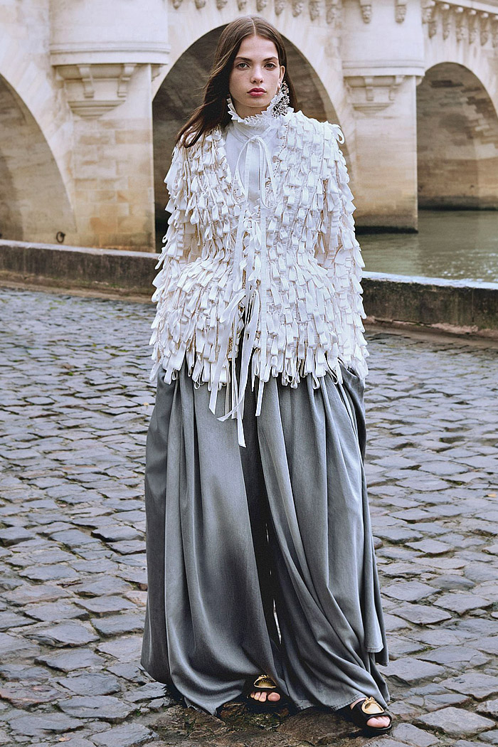 Christian Dior 2026 Pre-Fall Autumn Womens Fashion Trends Looks - Denim Jeans, Ostrich Feathers, Flowers Floral Embroidery, Hybrid Skirtpants, Wide Leg Baggy, Looped Ribbons, Geometric Angular, Concave Cutout Hem Tuxedo Jacket, Draped Curtain, Giant Bows, Capes, Houndstooth, Patchwork, Hoods Christian Dior 2026 Pre-Fall Womens Fashion Trends - Denim Jeans, Embroidery, Baggy, Ribbons, Tux, Draped Curtain, Bows, Capes