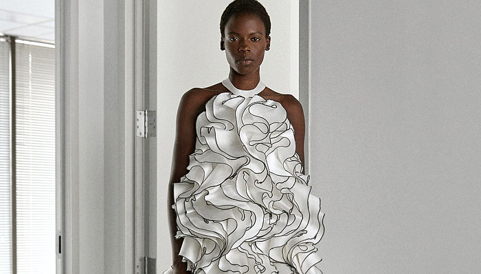 Greta Constantine 2026 Spring Summer Womens at NYFW - coveralls, sequins, flare, sheer, embroidered swirls, ruffles, peplum, cape