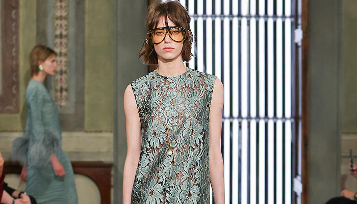 Gucci 2026 Resort Cruise Pre-Spring Womens Runway Collection - Retro Classic Leg O'Mutton Sleeves Blouse Office Check Suede Ribbon Paintbrush Flowers Floral Dress Scarf Fur Plush Outerwear Trench Coat Leather Pencil Skirt Stripes Monogram Logo Lace Embroidery Mesh Sheer Tights Stockings Studs Studded Teal Cinch Pleats Tied Knot Feathers Bedazzled Sequins Giglio Handbag