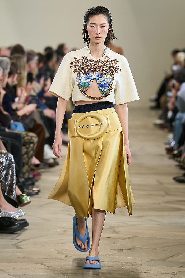 Paco Rabanne 2026 SS PFW: sequin cutout blouses, halterneck bikini tops, metallic foliage, floral miniskirts, capri leggings, oversized belts, crystal gems, bug-eye sunglasses, Paris runway.