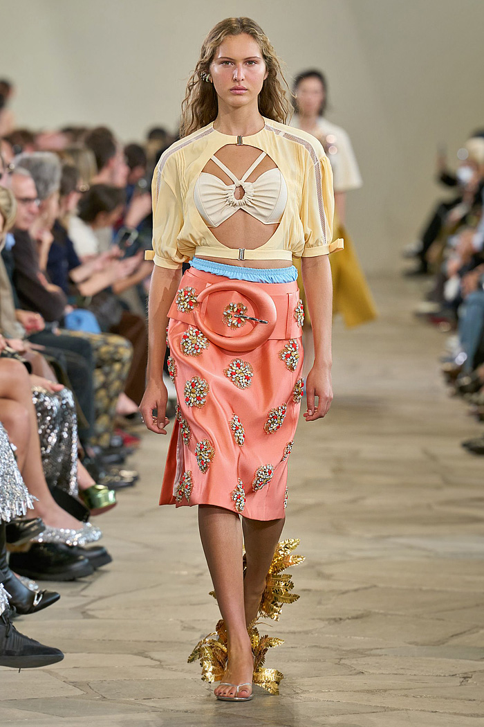 Paco Rabanne 2026 SS PFW: sequin cutout blouses, halterneck bikini tops, metallic foliage, floral miniskirts, capri leggings, oversized belts, crystal gems, bug-eye sunglasses, Paris runway.