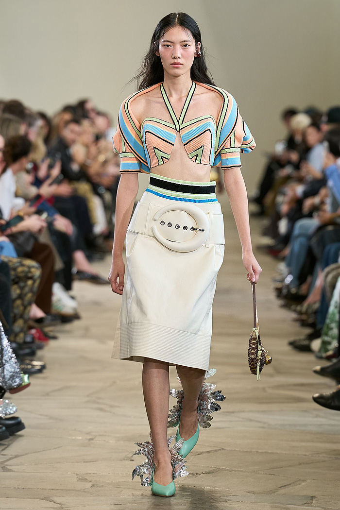 Paco Rabanne 2026 SS PFW: sequin cutout blouses, halterneck bikini tops, metallic foliage, floral miniskirts, capri leggings, oversized belts, crystal gems, bug-eye sunglasses, Paris runway.
