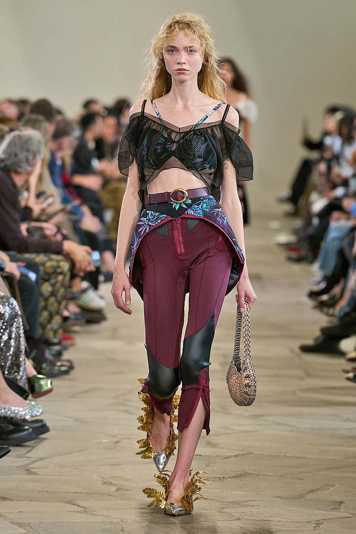 Paco Rabanne 2026 SS PFW: sequin cutout blouses, halterneck bikini tops, metallic foliage, floral miniskirts, capri leggings, oversized belts, crystal gems, bug-eye sunglasses, Paris runway.