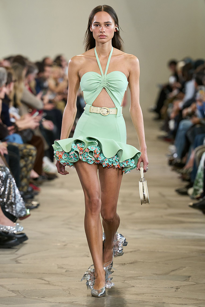 Paco Rabanne 2026 SS PFW: sequin cutout blouses, halterneck bikini tops, metallic foliage, floral miniskirts, capri leggings, oversized belts, crystal gems, bug-eye sunglasses, Paris runway.