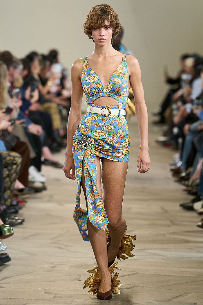 Paco Rabanne 2026 SS PFW: sequin cutout blouses, halterneck bikini tops, metallic foliage, floral miniskirts, capri leggings, oversized belts, crystal gems, bug-eye sunglasses, Paris runway.
