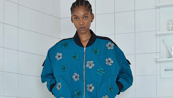 Paula Canovas Del Vas 2026 Spring Summer Womens at PFW with flowers, denim jeans, knit, halterneck, miniskirt, stripes, pompoms