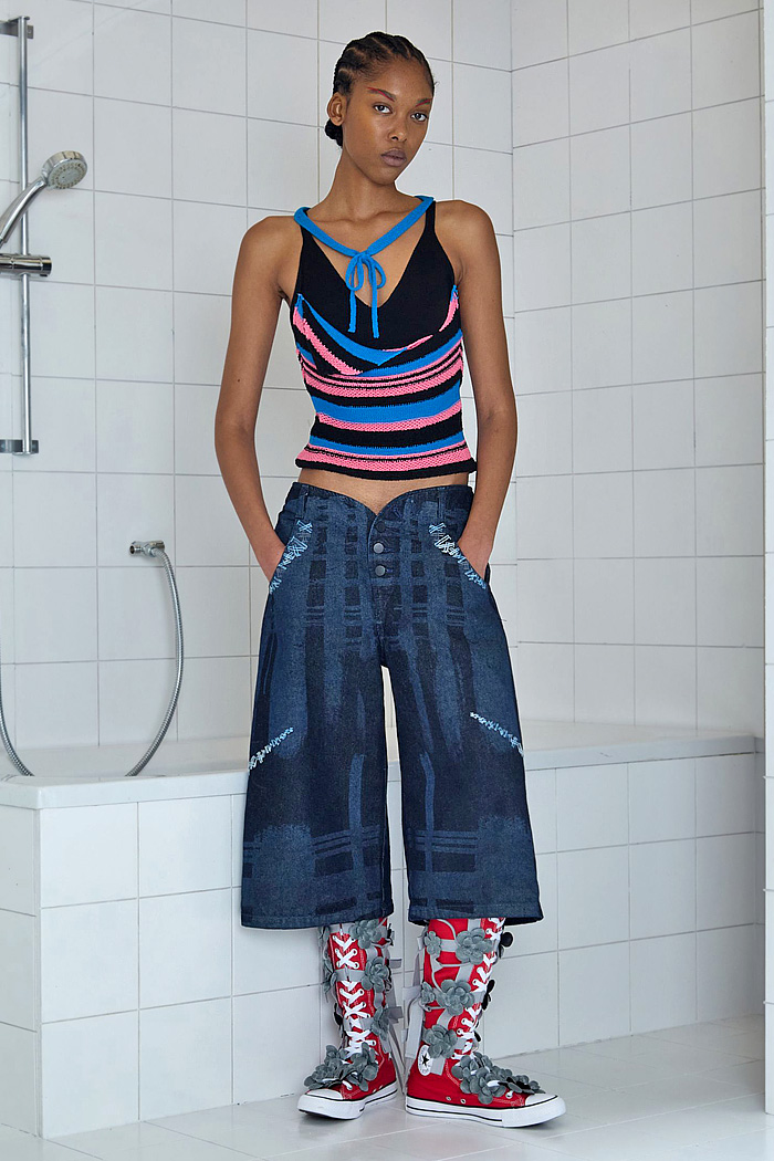 Paula Canovas Del Vas 2026 Spring Summer Womens at PFW with flowers, denim jeans, knit, halterneck, miniskirt, stripes, pompoms