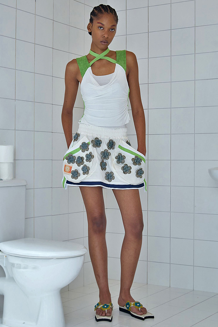 Paula Canovas Del Vas 2026 Spring Summer Womens at PFW with flowers, denim jeans, knit, halterneck, miniskirt, stripes, pompoms