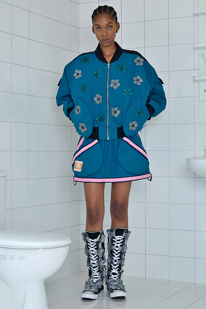 Paula Canovas Del Vas 2026 Spring Summer Womens at PFW with flowers, denim jeans, knit, halterneck, miniskirt, stripes, pompoms