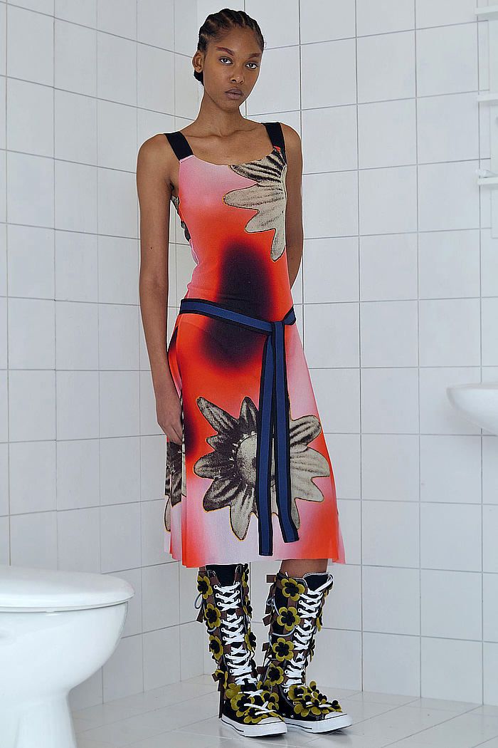 Paula Canovas Del Vas 2026 Spring Summer Womens at PFW with flowers, denim jeans, knit, halterneck, miniskirt, stripes, pompoms