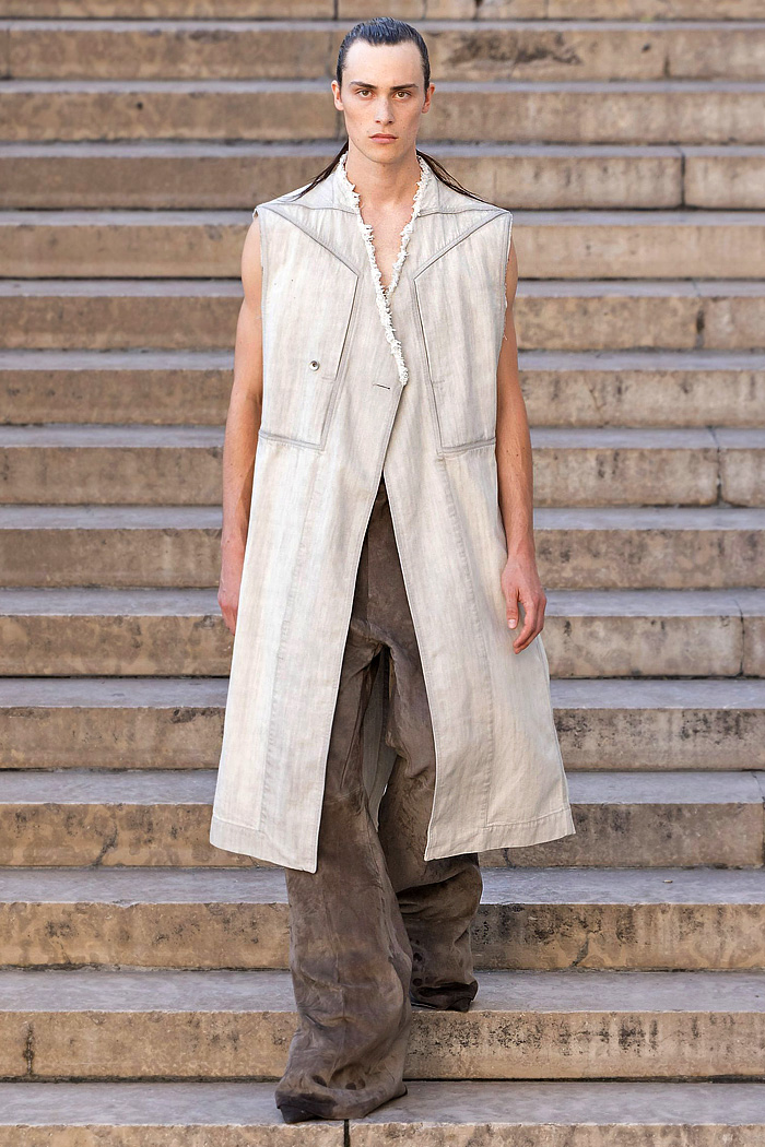 Rick Owens 2026 Spring Summer Mens: vest, sequins, tabard, studs, straps, crop jacket, biker, fringes, carabiner, wrapped boots