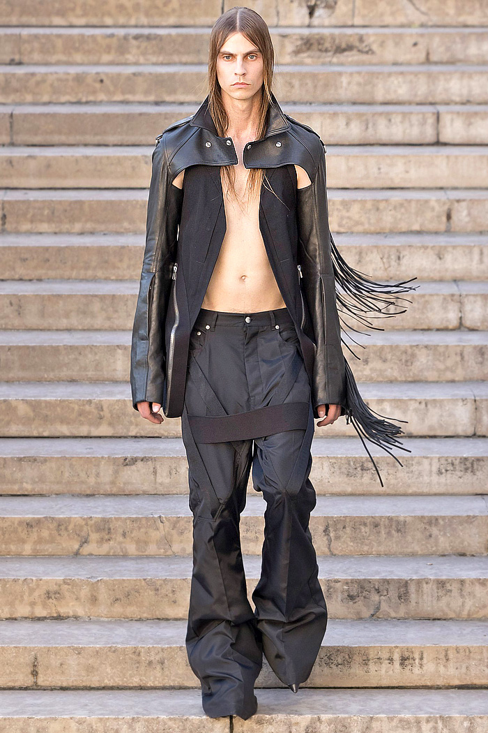 Rick Owens 2026 Spring Summer Mens: vest, sequins, tabard, studs, straps, crop jacket, biker, fringes, carabiner, wrapped boots