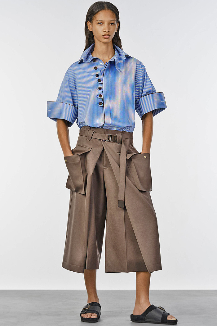 Sacai 2027 Resort Cruise Pre-Spring Womens Collection Fashion Trends - Deconstructed Denim Jeans Patchwork Hybrid Mix Panel Blazer Sheer Shirtdress Onesie Cargo Utility Pockets Baggy Wide Leg Culottes Miniskirt Cutoffs Shorts Sleepwear Cuffs Multiple Buttons Nautical Sailor Pants Lace Noodle Strap Petal Hem Blouse Geometric Handkerchief Hem Knit Cardigan Military Officer Trench Coat Sacai 2027 Resort Womens Fashion Trends - Deconstructed Denim Jeans Patchwork Hybrid Pockets Sleepwear Cuffs Sailor Pants Lace