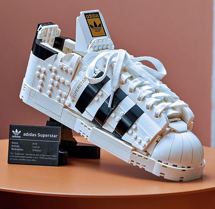 LEGO adidas Originals Superstar Sneakers Collaboration - Vintage Classic Iconic Basketball Sport Shoes Footwear LEGO Bricks White Kicks Black Stripes Low Cut Top Old Skool Toy Gold Foil Accents Laces - 2021 Spring Summer Collection - Quirky Fashion Finds by Denim Jeans Observer