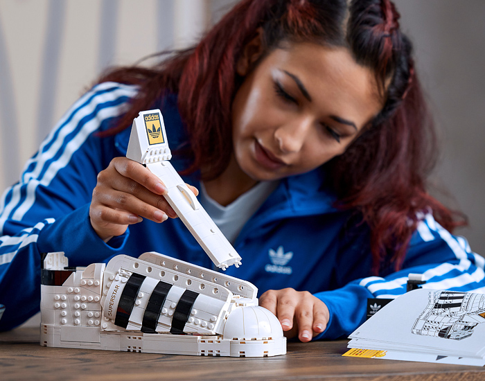 LEGO adidas Originals Superstar Sneakers Collaboration - Vintage Classic Iconic Basketball Sport Shoes Footwear LEGO Bricks White Kicks Black Stripes Low Cut Top Old Skool Toy Gold Foil Accents Laces - 2021 Spring Summer Collection - Quirky Fashion Finds by Denim Jeans Observer