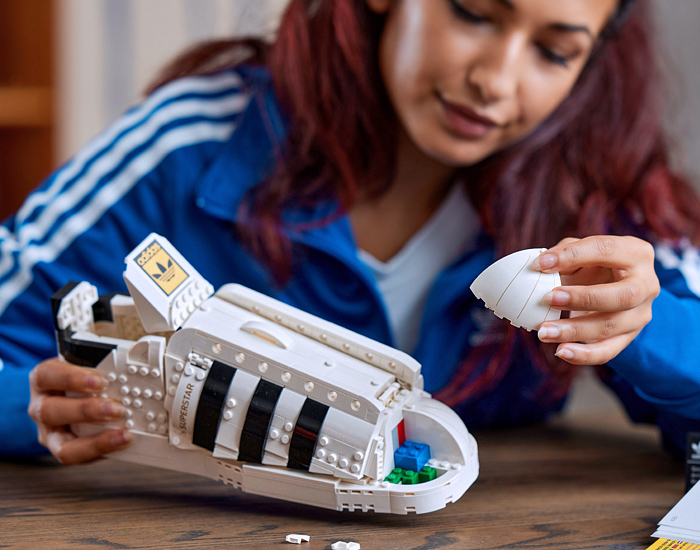 LEGO adidas Originals Superstar Sneakers Collaboration - Vintage Classic Iconic Basketball Sport Shoes Footwear LEGO Bricks White Kicks Black Stripes Low Cut Top Old Skool Toy Gold Foil Accents Laces - 2021 Spring Summer Collection - Quirky Fashion Finds by Denim Jeans Observer