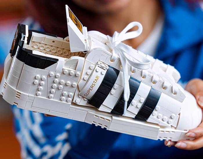 LEGO adidas Originals Superstar Sneakers Collaboration - Vintage Classic Iconic Basketball Sport Shoes Footwear LEGO Bricks White Kicks Black Stripes Low Cut Top Old Skool Toy Gold Foil Accents Laces - 2021 Spring Summer Collection - Quirky Fashion Finds by Denim Jeans Observer