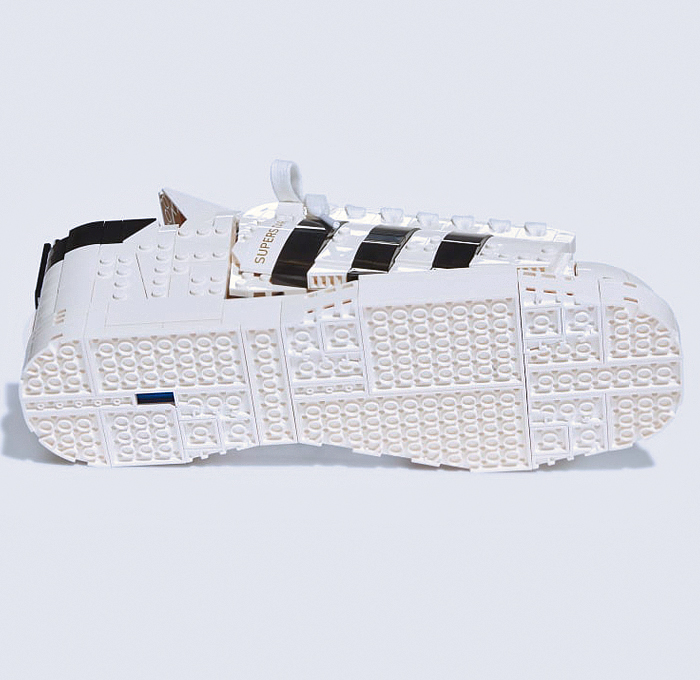 LEGO adidas Originals Superstar Sneakers Collaboration - Vintage Classic Iconic Basketball Sport Shoes Footwear LEGO Bricks White Kicks Black Stripes Low Cut Top Old Skool Toy Gold Foil Accents Laces - 2021 Spring Summer Collection - Quirky Fashion Finds by Denim Jeans Observer