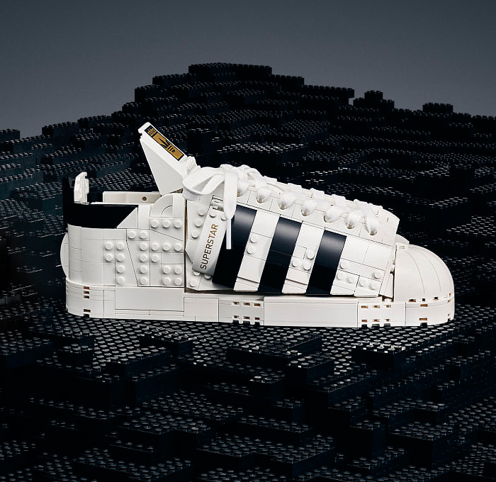 LEGO adidas Originals Superstar Sneakers Collaboration - Vintage Classic Iconic Basketball Sport Shoes Footwear LEGO Bricks White Kicks Black Stripes Low Cut Top Old Skool Toy Gold Foil Accents Laces - 2021 Spring Summer Collection - Quirky Fashion Finds by Denim Jeans Observer